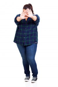 overweight woman do not want to take her pictures